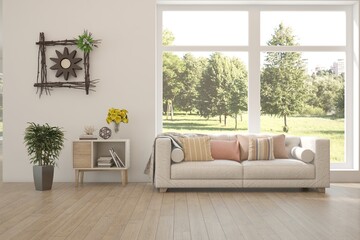 Fototapeta premium Modern interior concept with sofa and summer landscape in window. 3D illustration