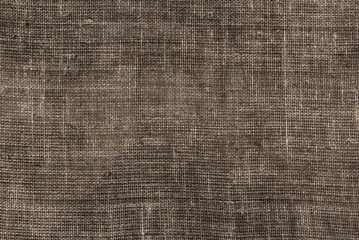 Burlap texture. A piece of torn burlap on a white background. Canvas. Packing material