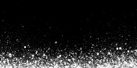 white flakes is surrounding randomly on black background, winter morning snow flakes are dancing in the air, white glitter background for presentation.