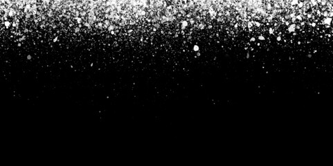 white flakes is surrounding randomly on black background, winter morning snow flakes are dancing in the air, white glitter background for presentation.