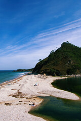 A view of the beach and an estuary in Asturias, Spain.