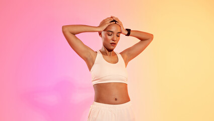 Tired slim sweat young latin woman athlete in sportswear hold head with hands, suffer from headache