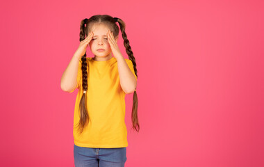 Kids Depression. Portrait of upset little girl touching head with hands