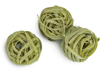 Raw tagliatelle green pasta with spinach isolated on white background. Top view. Flat lay