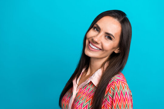 Closeup portrait of charming young lady revealing white perfect toothy smile isolated over teal blue color background