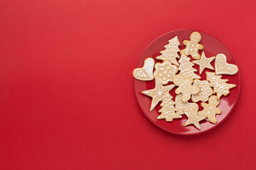 Fototapeta na wymiar Cute homemade Christmas cookies on color background,top view