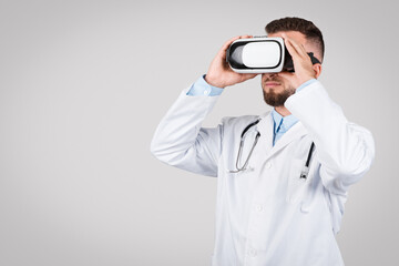 Doctor exploring with virtual reality headset, copy space