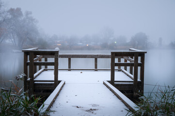 dock on the lake in snow