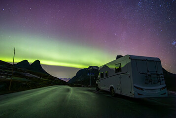 Northern lights and motorhome camper in Trollstigen road in Norway, Europe - obrazy, fototapety, plakaty