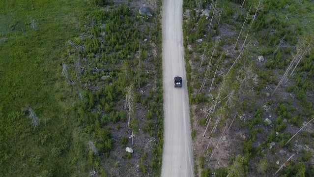 Aerial Footage of UTV on Dirt Road in the Beartooth Mountains, Montana, Summertime