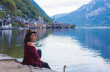 Fototapeta premium Latina woman on vacation in Alps mountains in Austria. Holidays and vacation concept