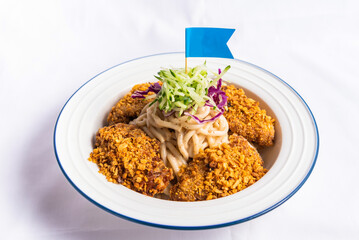 Typhoon Shelter Chicken Wing with fish noodle soup served on bowl isolated on napkin side view of fastfood