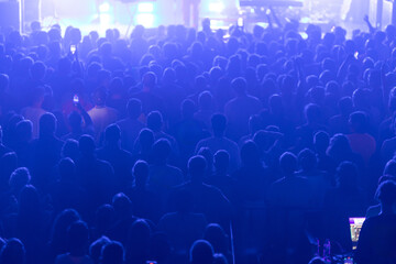 A densely packed crowd at a concert.