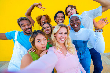 Blonde woman taking a selfie with multi-ethnic friends