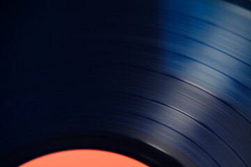 Sound tracks on a vinyl blue record closeup macro photo.