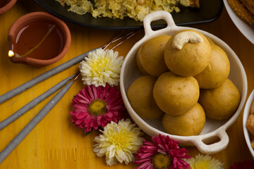 Besan ladoo or laddu are delicious sweet balls made with gram flour, sugar, ghee cardamoms, indian mithai made on diwali festival