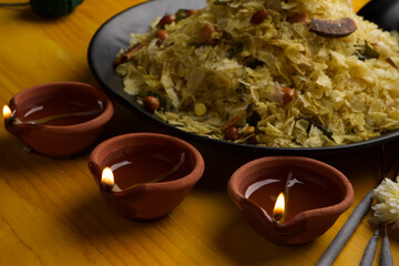 Poha Chivda or Chiwada. Diwali special savory snack, made out of Flattened rice, fried peanuts, curry leaves and some spices. Traditional Indian Diwali Snacks.