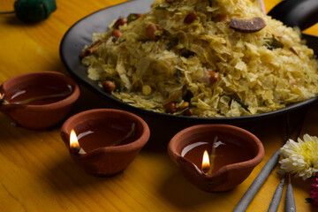 Poha Chivda or Chiwada. Diwali special savory snack, made out of Flattened rice, fried peanuts, curry leaves and some spices. Traditional Indian Diwali Snacks.