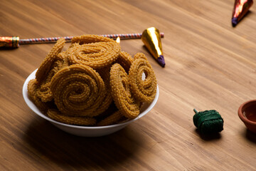 Indian Traditional Tea Time Snack Chakli, a deep fried snack, It is known as Chakali, Murukku,...