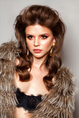 young model with professional make up and voluminous hairstyle