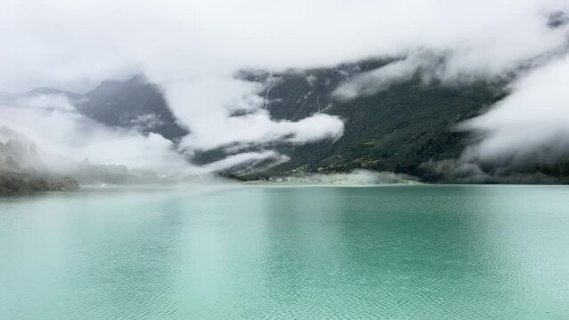 A scene of a very rainy day at Oldevatnet Lake and the Briksdal Valley, Norway