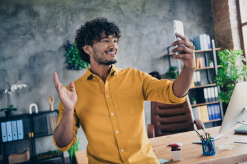 Photo of funny nice man hr recruiter dressed stylish clothes speaking online with applicants indoors