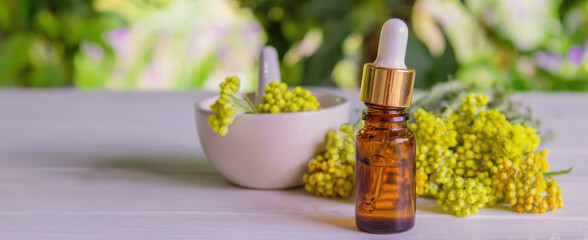 immortelle essential oil. selective focus