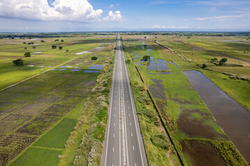 Aerial of Central Luzon Link Expressway , better known by its acronym CLLEX, stretching from La Paz, Tarlac to Nueva Ecija. - obrazy, fototapety, plakaty