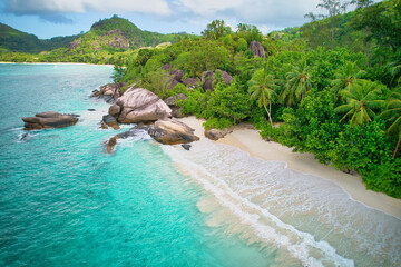 Drone of baie lazare beach, huge granite stones, white sandy beach, turquoise water, coconut palm trees, sunny day, Mahe Seychelles 4