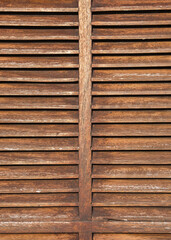 Fototapeta premium Window with wooden shutters, wooden blinds. Wood texture, wood background