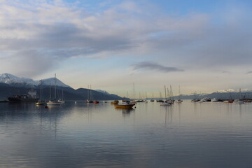 Boats reflecting in the Ushuaia harbour at dawn