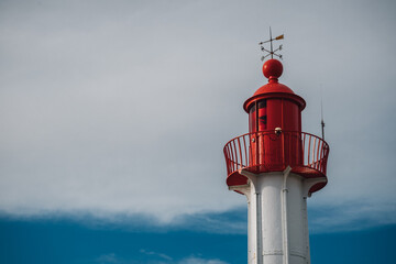 red lighthouse on a sky background