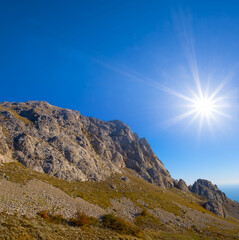 mountain ridge under a sparkle sun