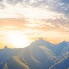 green mountain ridge at the sunset