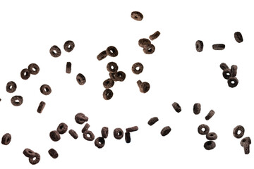 Chocolate rings cereal spill out into a bowl. Breakfast.