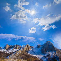 snowbound mountain ridge at the sunny day