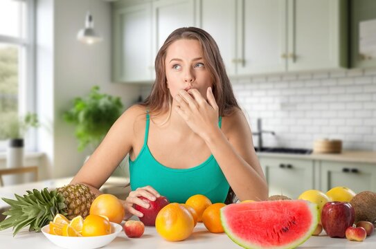 Happy young woman eats fresh fruits, AI generated image