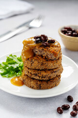 Vegan bean burgers with gravy sauce, patties or cakes, healthy alternative food