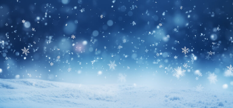 Falling snowflakes and Bokeh with white snow on a blue background.