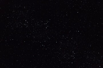 Fototapeta premium White and blue Confetti on black. Isolated blue Dust Particles. christmas card . Birthday Card. 