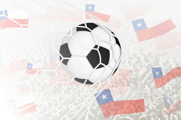 National Football team of Chile scored goal. Ball in goal net, while football supporters are waving the Chile flag in the background.