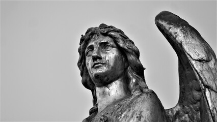 Statue of angel with big wings black and white 