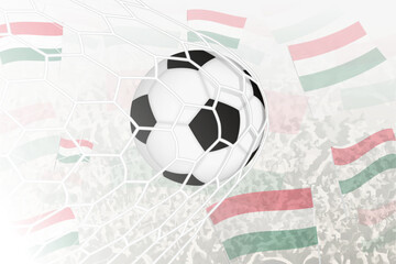 National Football team of Hungary scored goal. Ball in goal net, while football supporters are waving the Hungary flag in the background.