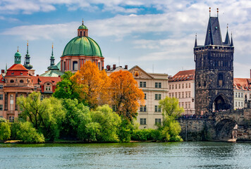 Old town bridge tower and St. Francis of Assisi church in Prague, Czech Republic