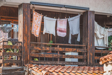 Clothes drying on balcony. Ordinary life in old city