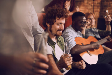Friends enjoying music and drinks in a cozy bar