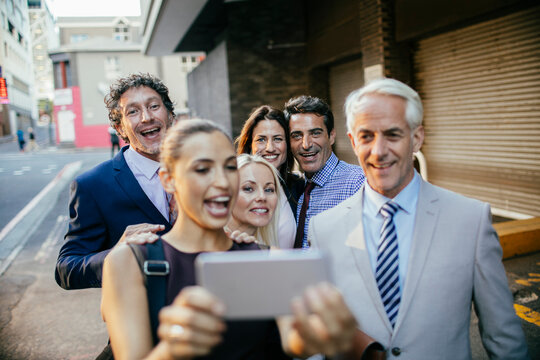 Cheerful group of professionals taking a selfie together