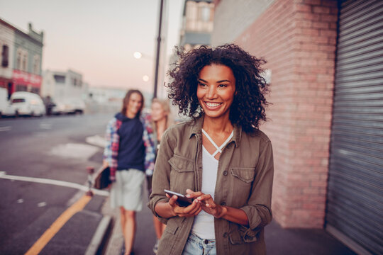 Radiant young woman enjoying her time in the city