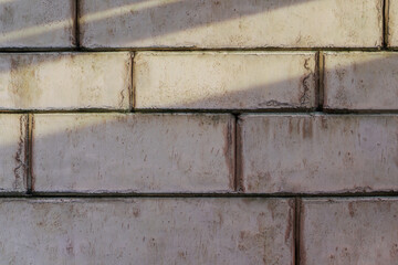 3D rendering of stone blacks wall in the evening sunlight