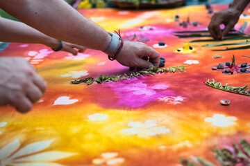 Obraz premium Hands removing leaves and flowers after the fabric paint had dried, Mahe Seychelles 8